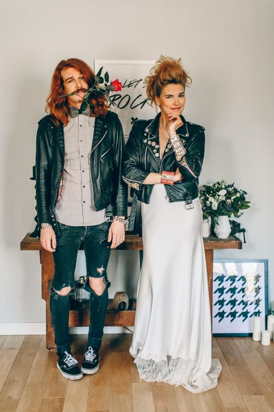 a unique groom's look with a grey shirt, black jeans, a black leather jacket and black sneakers is fun
