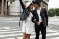 black leather jackets plus matching hats give the couple a cool and edgy look and show off their taste