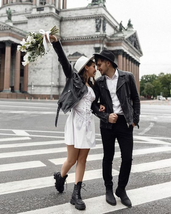 black leather jackets plus matching hats give the couple a cool and edgy look and show off their taste