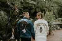 bride and groom wearing denim jackets personalized with their dogs and their names look super cute