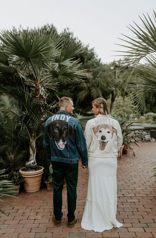 bride and groom wearing denim jackets personalized with their dogs and their names look super cute