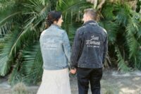 matching denim jackets with white calligraphy are great to accent the couple’s look