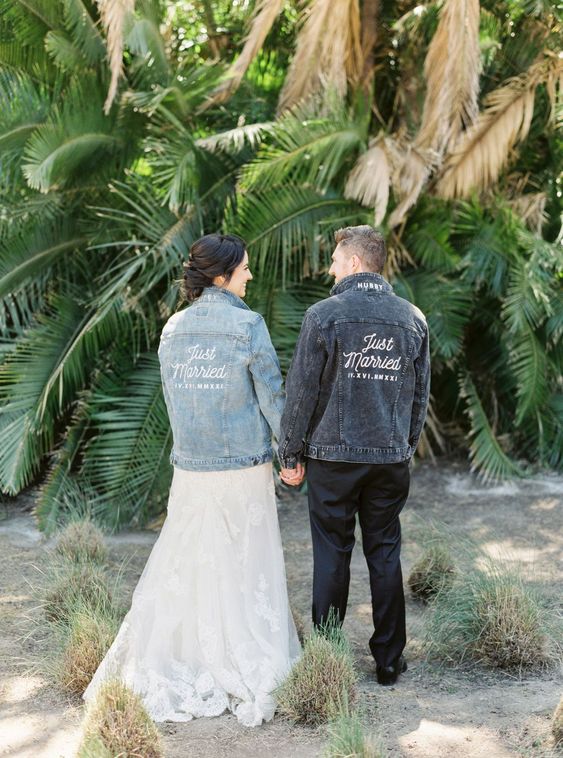 matching denim jackets with white calligraphy are great to accent the couple's look