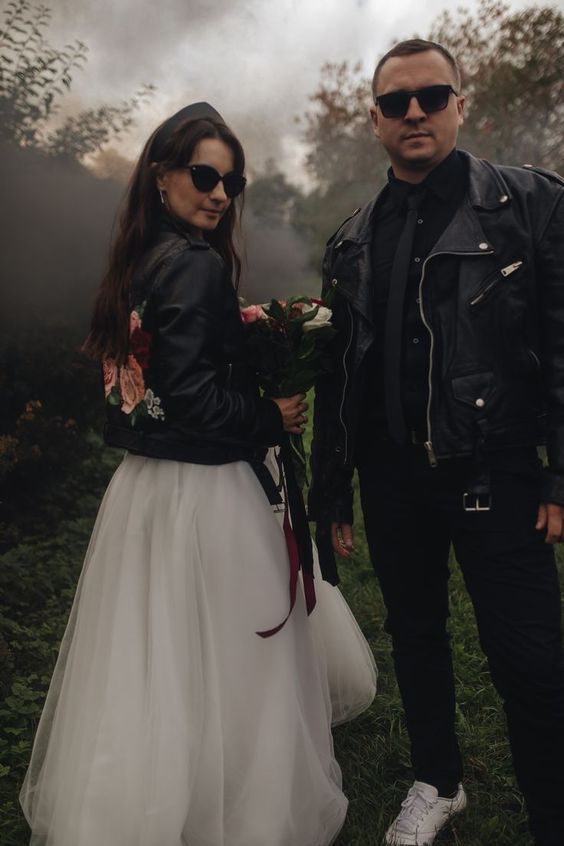 rock couple's looks with black leather jackets, a floral one for the bride and a usual one for the groom