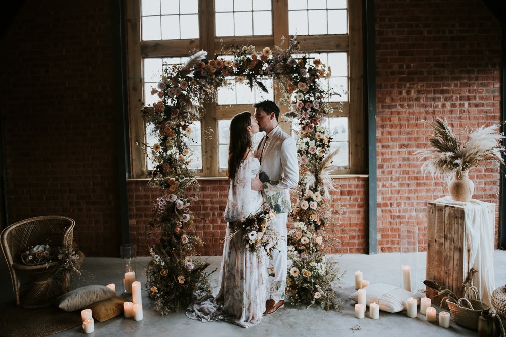 This luxurious bohemian wedding shoot is filled with trendy dried blooms, greenery and features chic boho wedding dresses