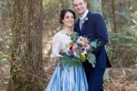 02 The bride was wearing a white lace off the shoulder top and a blue full skirt, the groom was wearing a bright blue suit with a colorful floral tie
