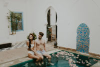 02 The couple spent some time in a boho Moroccan riad with a pool with floating blooms in it