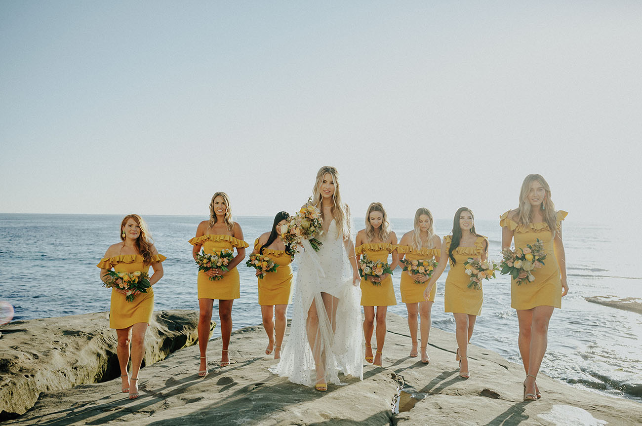 The bridesmaids were rocking cheerful bright yellow mini dresses with ruffles