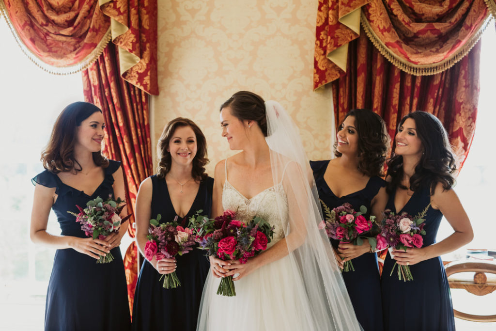 The bouquets were bright and bold, with textural greenery and added color to the wedding