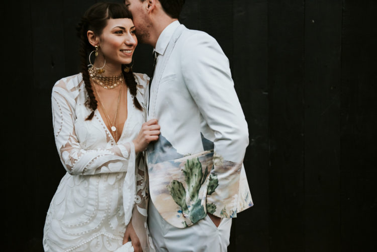 The second wedding gown was a lace one with bell sleeves and a plunging neckline plus boho accessories