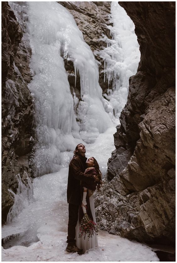 a frozen waterfall is a fantastic place to tie the knot, it looks like an ice fairytale