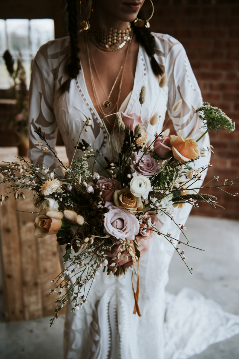 The wedding bouquet was done with earthy blooms, herbs, dried blooms and much dimension and texture