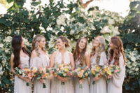 08 The bridesmaids were wearing mismatching off-white maxi dresses to make up a trendy white bridal party