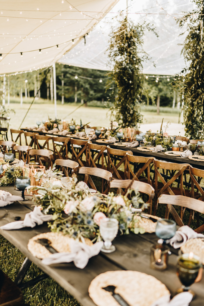 The reception was done outside, in a tent, there was lush greenery and colored glasses