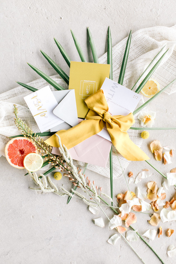 The wedding invitation suite was done with modern printing, marigold ribbons and an envelope