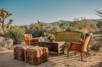 08 The wedding lounge was done with elegant vintage furniture in desert shades and a cool chest coffee table