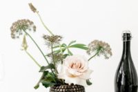 10 a very catchy embellished round vase with some dried blooms and a single blush roses has a big impact