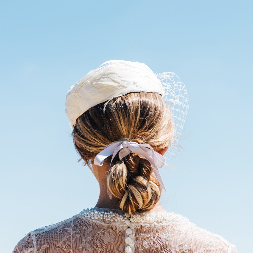 wearing a ribbon in your hair on your wedding day, doesn't have to mean skipping other accessories, a wedding hat or veil