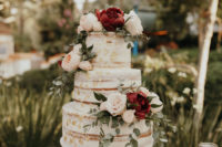 12 The naked wedding cake was decorated with gold leaf and blush and burgundy blooms plus eucalyptus