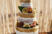 13 The wedding cake was semi naked, with gold touches, dried and usual citrus slices plus blooms