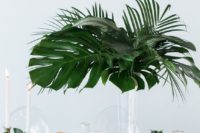 a minimalist tall wedding centerpiece with a tropical vibe
