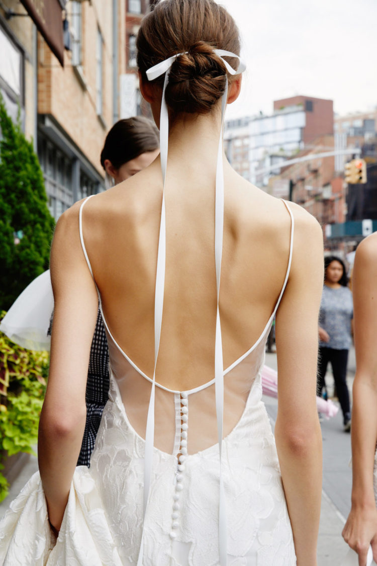 keep you ribbon extra long and add some drama to a ribbon-tied bun, great for a minimalist bridal look