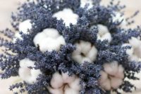 a catchy wedding centerpiece or bouquet of lavender and cotton is a cute and unusual arrangement