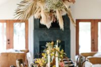 a fantastic overhead arrangement of dried palm leaves, pampas grass and baby’s breath brigns that wow factor