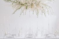 a fantastic overhead lunaria and greenery wedding decoration will highlight your reception and make it look wow