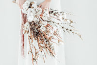 a large and textural wedding bouquet of cotton branches and dried herbs can be easily arranged by you yourself
