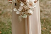 a sophisticated wedding bouquet with lunaria, dried herbs, blush and white blooms