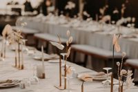 minimalist wedding centerpieces of gold bud vases, anthuriums, grasses are amazing for a minimalist wedding