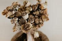02 The wedding bouquet was done with dried blooms with earthy ribbons