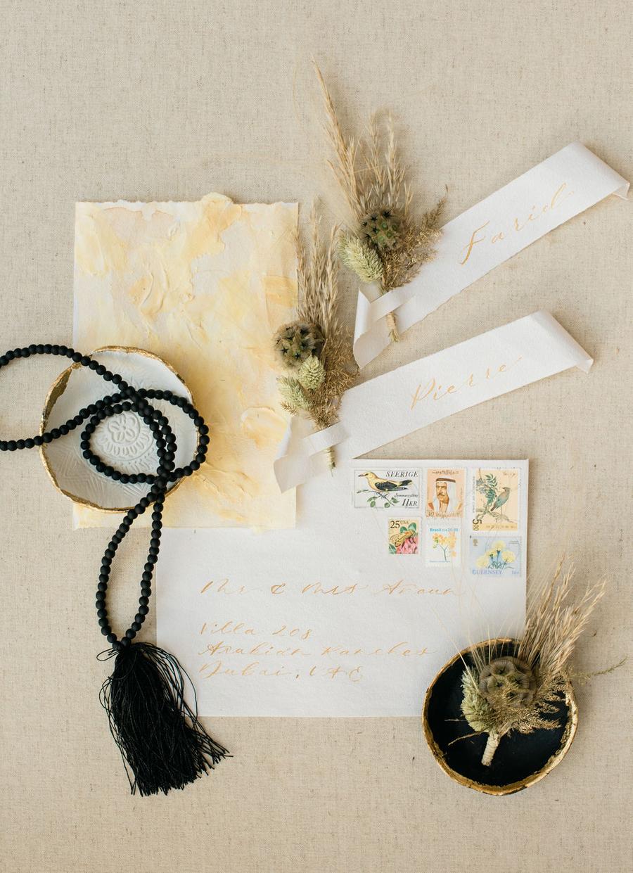 The wedding stationery incorporated yellows and mustard   the colors that were incorporated into the shoot decor