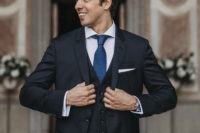 groom in a navy suit