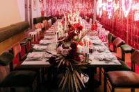The reception space was done with neon lights, bright statement florals and rock n roll aesthetics