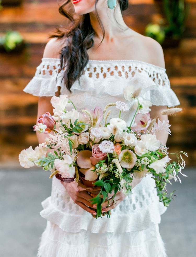 The wedding bouquet was done with white, blush and dusty pink blooms and greenery