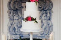 07 The wedding cake was white, sleek and texural, with bougainvilleas