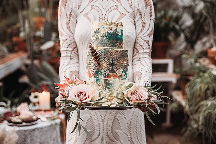 The wedding cake was totally boho, with watercolors and a folksy pattern plus a feather