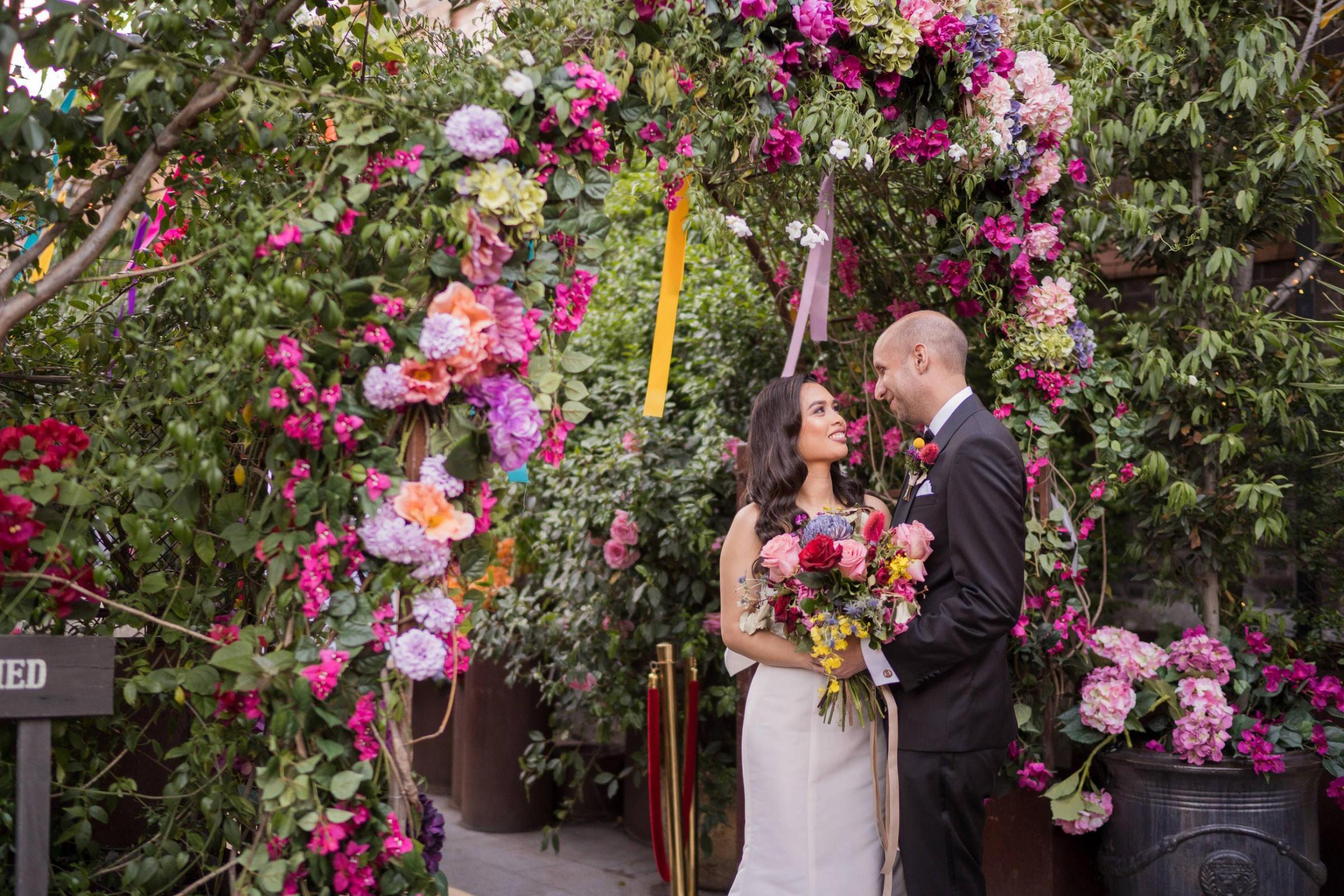 The wedding gate was done with super bright florals and ribbons