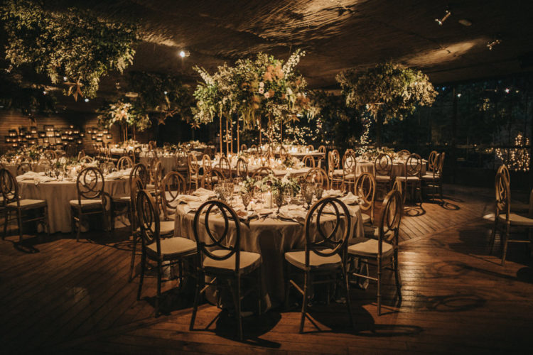 There were many hanging greenery and floral installations and matching tall centerpieces