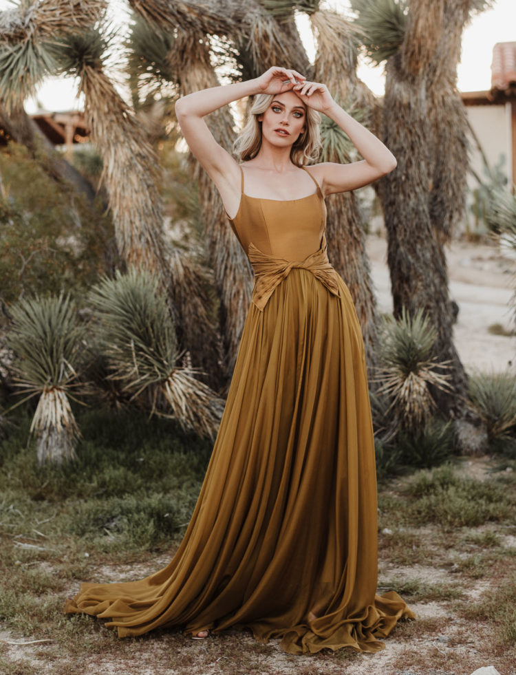 The second wedding dress was done in mustard, with a sleek bodice with spaghetti straps and a pleated skirt