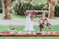 09 The wedding cake was decorated with geometric decor, bright blooms and leaves