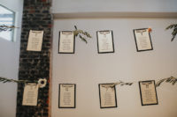 10 The seating chart was suspended in the air and decorated with blooms and greneery