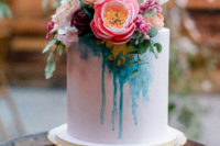 10 The wedding cake combined pink and teal and lush fresh blooms