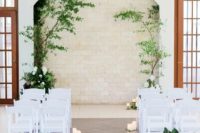 a modern wedding aisle decor in tropical style