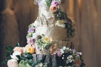 20 a birch bark wedding cake placed on a tree stump with blooms and greenery and decorated with florals and greenery, too