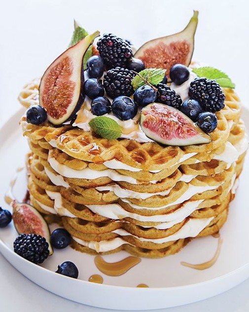 a cardamom waffle wedding cake with caramel, figs, fall berries and mint is a fantastic dessert