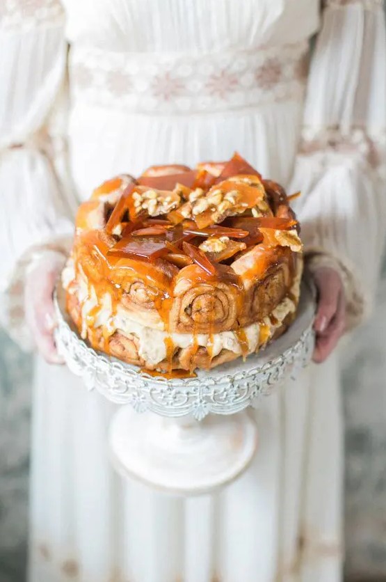 a cinnamon roll wedding cake with caramel shards and caramel drip is a fantastic option instead of a usual cake
