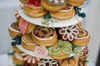 a colorful glazed donut tower in boho style will be a nice alternative to a usual wedding cake, and it’s delicious